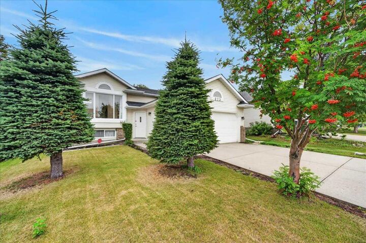 Property Photo:  273 Sandarac Drive NW  AB T3K 3W8 