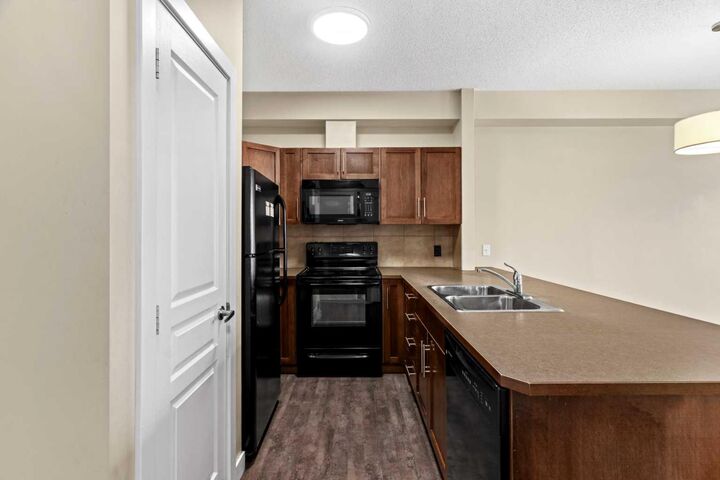 Property Photo:  10 Panatella Road NW 212  AB T3K 0V4 