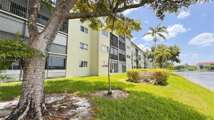 Property Photo:  1400 SW 131st Way 305Q  FL 33027 