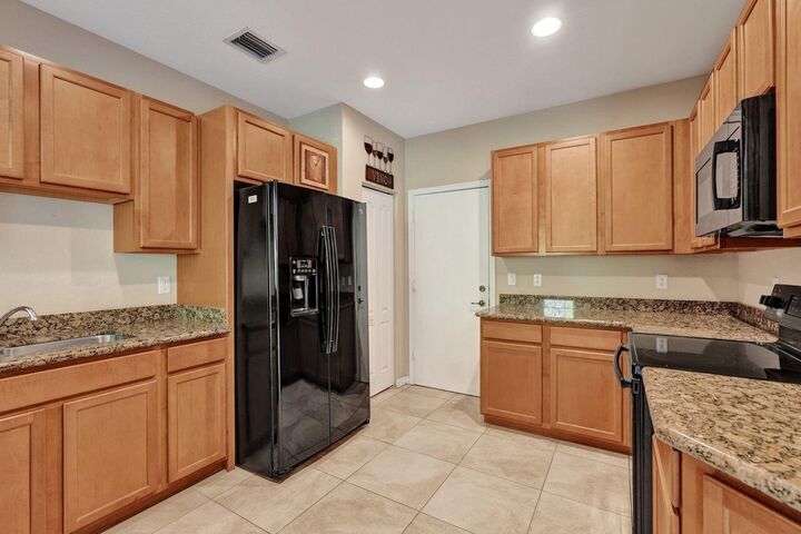 Property Photo:  4603 Cohune Palm Court  FL 33463 