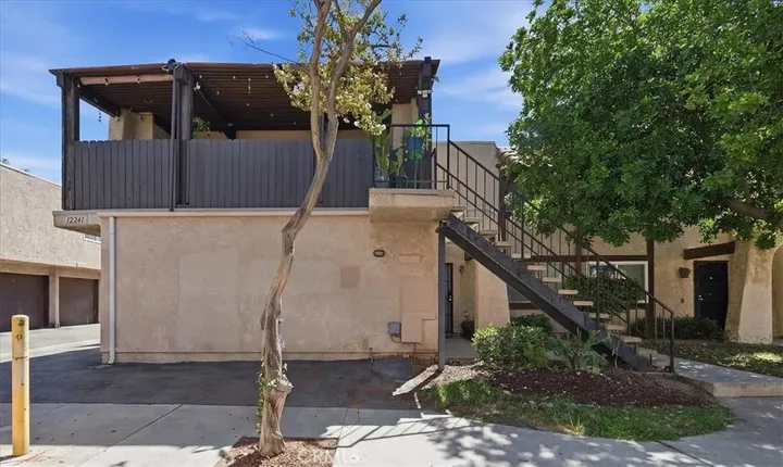 Property Photo:  12241 Carnation D  CA 92557 