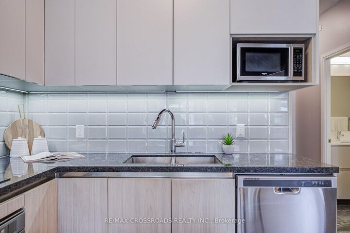 Property Photo: 15 Water Walk Drive 335 ON L6G 0G2