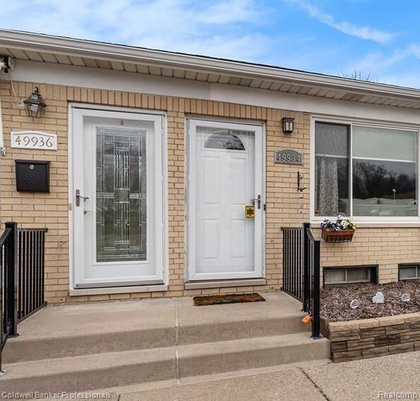 Property Photo:  49936 Helfer Boulevard W 8  MI 48393 