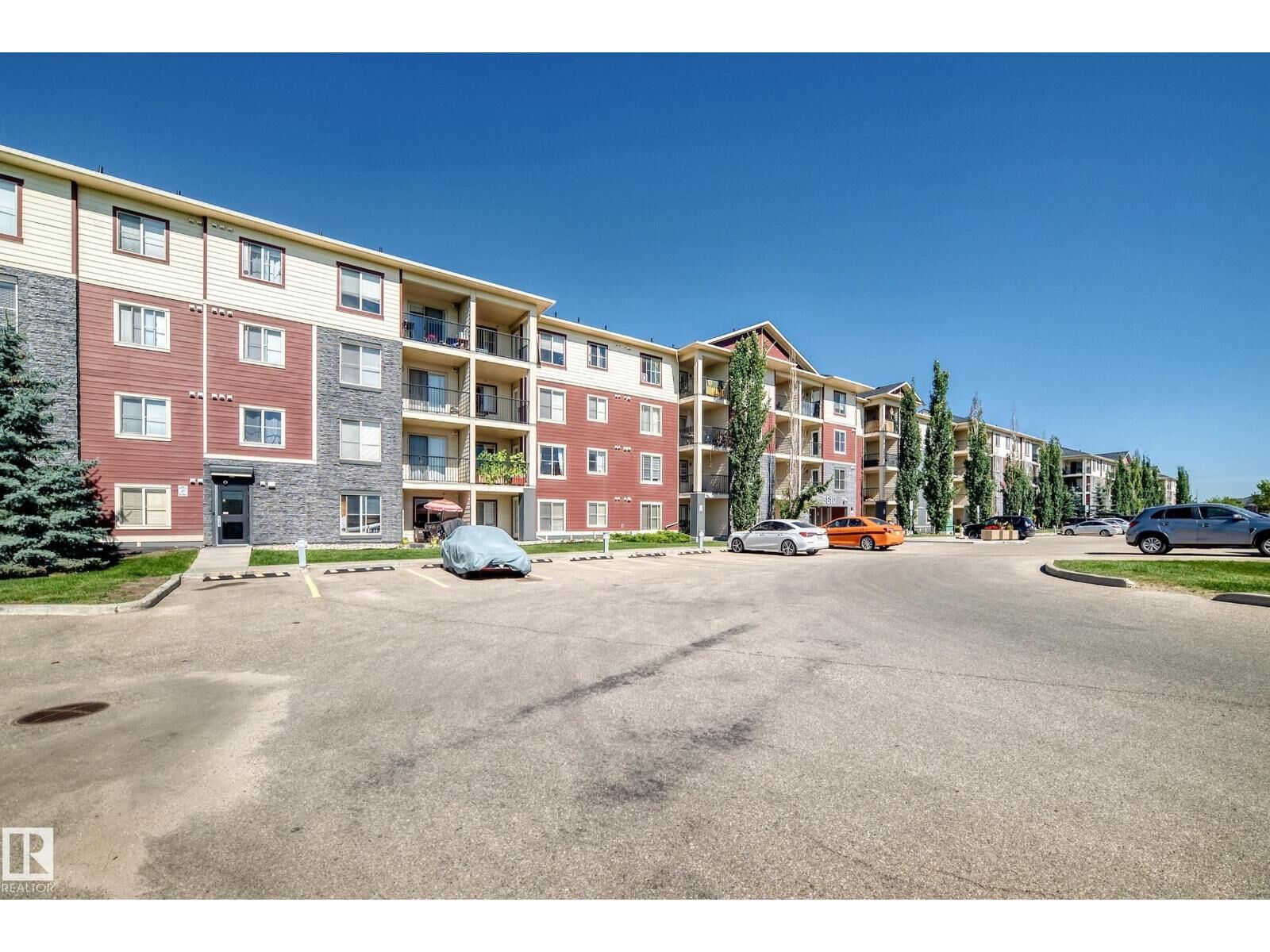 Property Photo:  #218 5810 Mullen Pl NW NW  AB T6R 0W3 