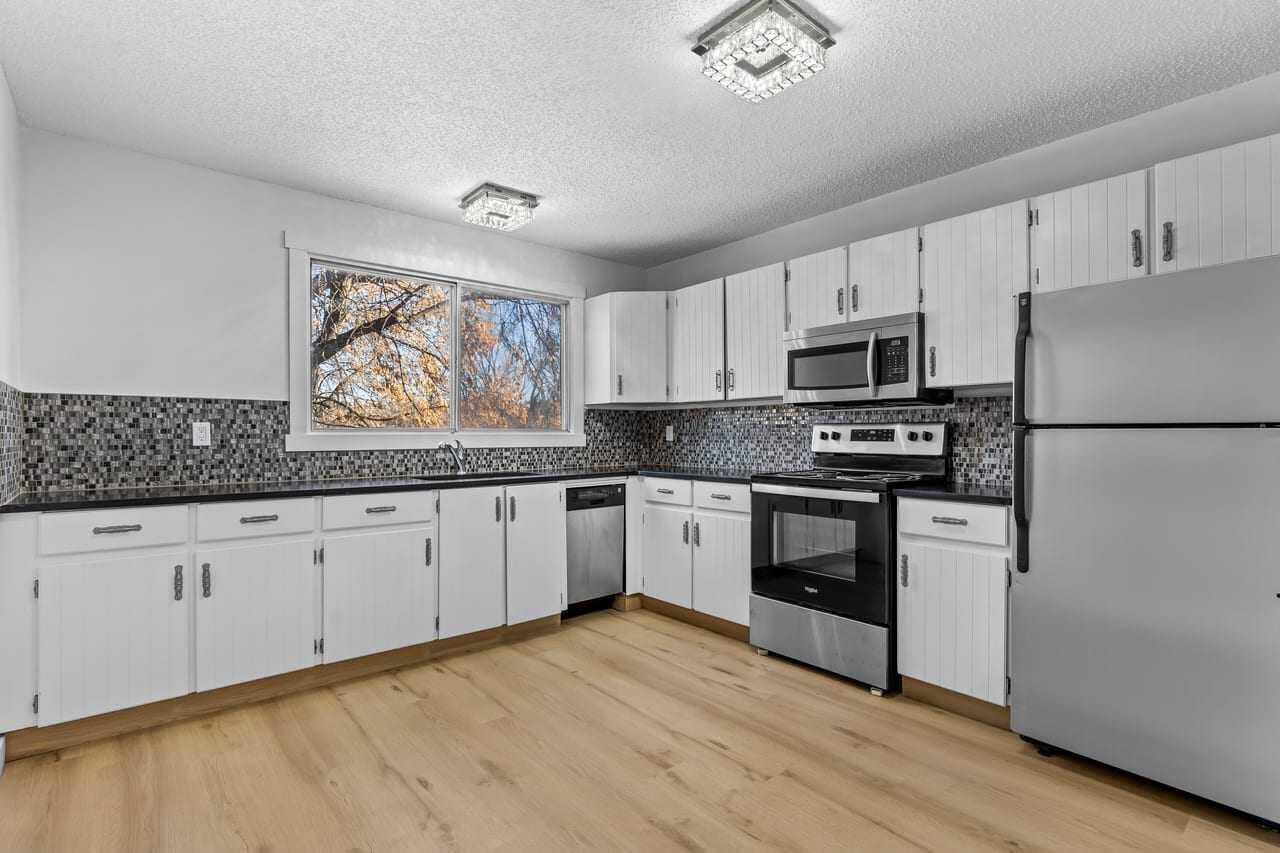 Property Photo:  7006A Bowness Road NW  AB T3B 0G4 