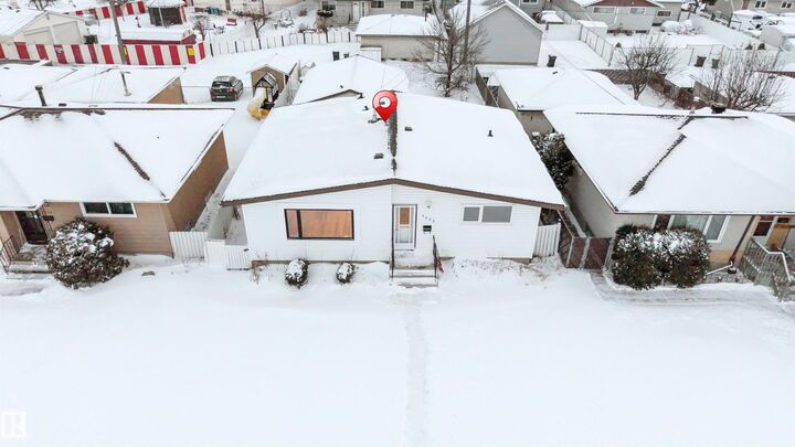Property Photo:  7303 130 Ave NW  AB T5C 1Y1 