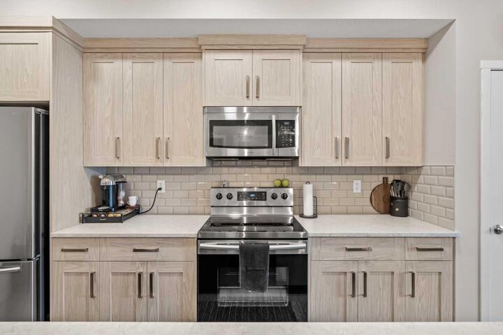 Property Photo:  370 Harvest Hills Common 205  AB T3K 2M8 