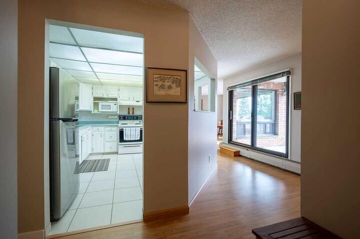 Property Photo:  9500 Oakfield Drive SW 211  AB T2V 0L1 