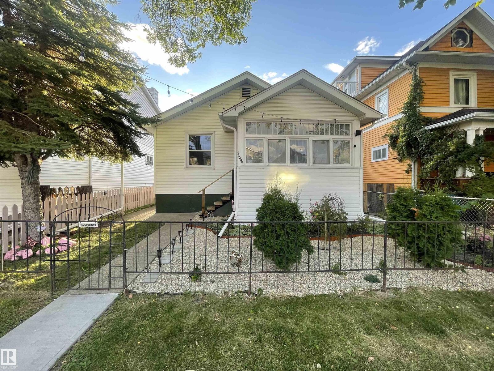 Property Photo:  11230 96 Street NW  AB T5G 1S9 