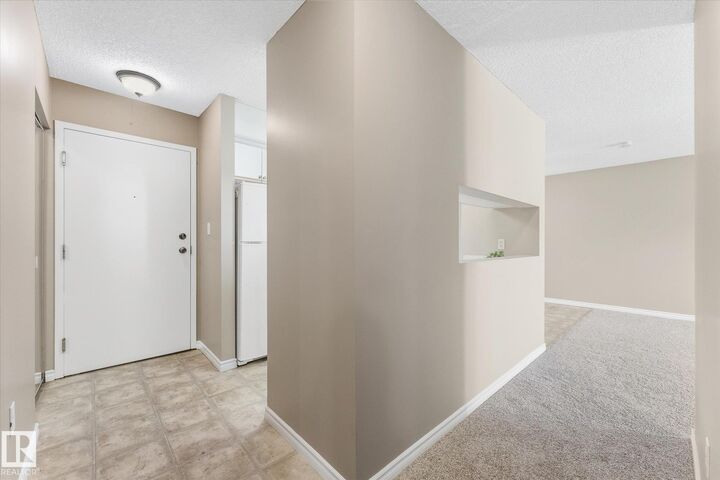 Property Photo:  2508 50 Street NW 104  AB T6L 6X9 