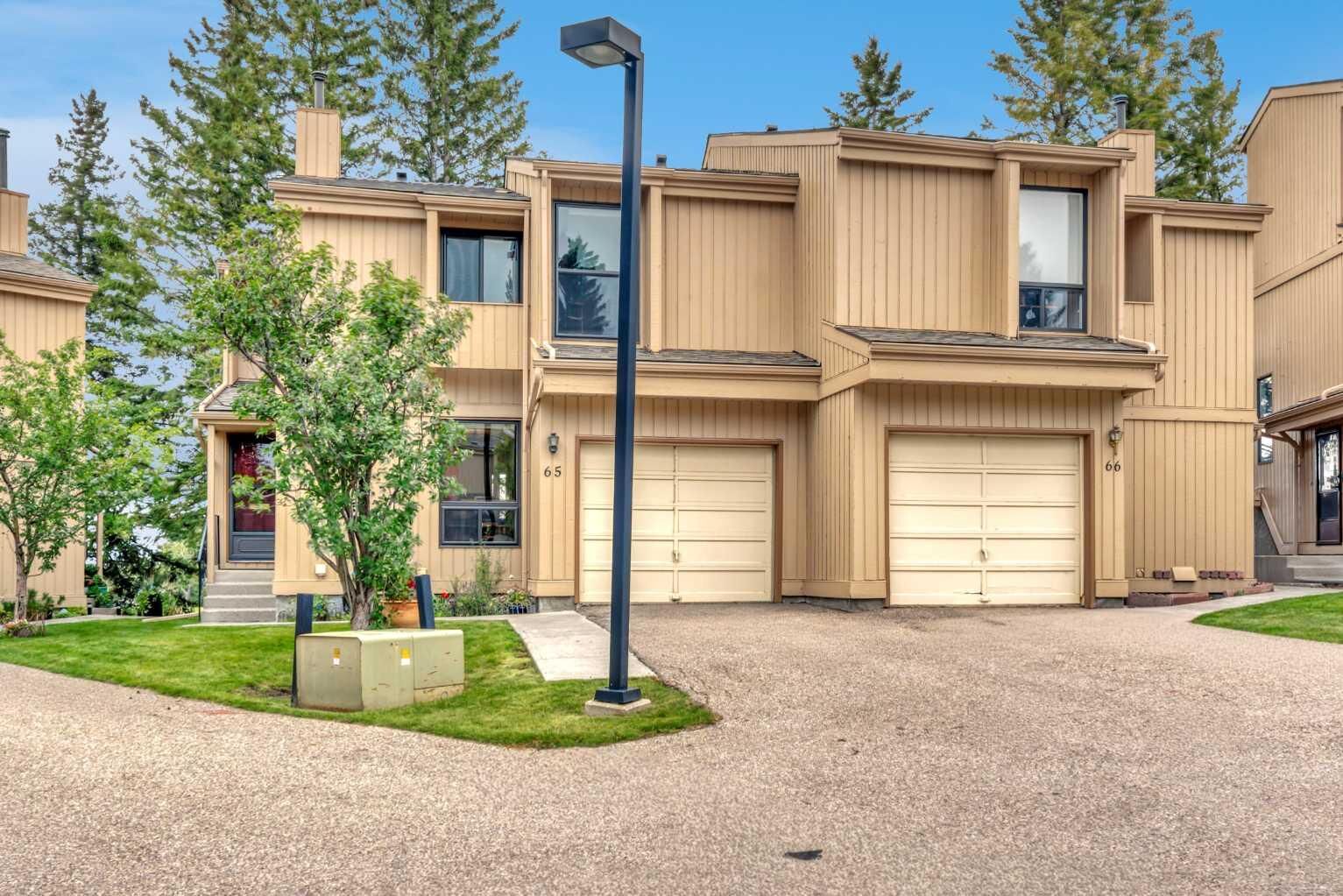 Property Photo:  70 Beacham Way NW 65  AB T3K 1R8 