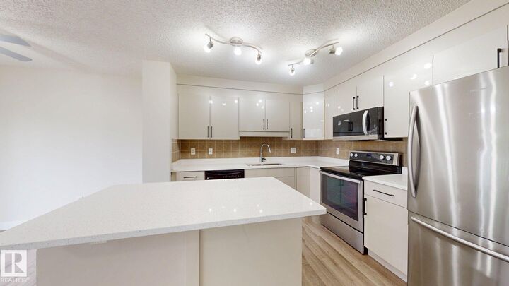Property Photo:  1150 37B Avenue NW  AB T6T 0E6 
