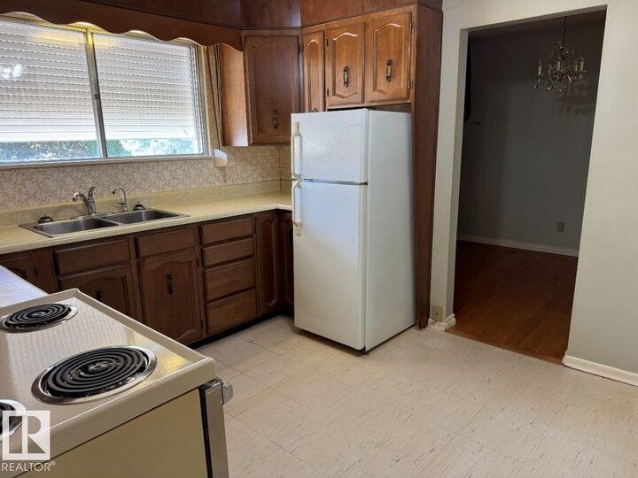Property Photo:  9119 130 Avenue NW  AB T5E 0S1 