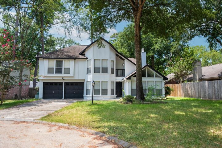 Property Photo:  31 N Drifting Leaf Court  TX 77380 