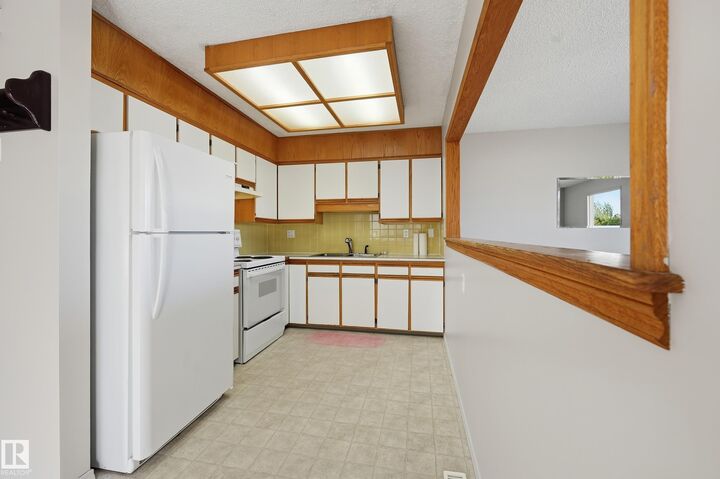 Property Photo:  13210 39A Street NW  AB T5A 3J5 