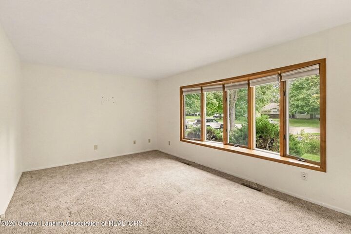 Property Photo:  117 Woodhaven Drive  MI 48917 