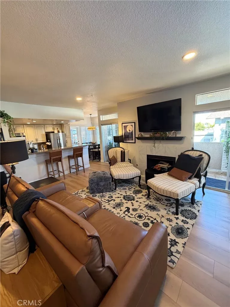 Property Photo:  4591 Warner Ave. 105  CA 92649 