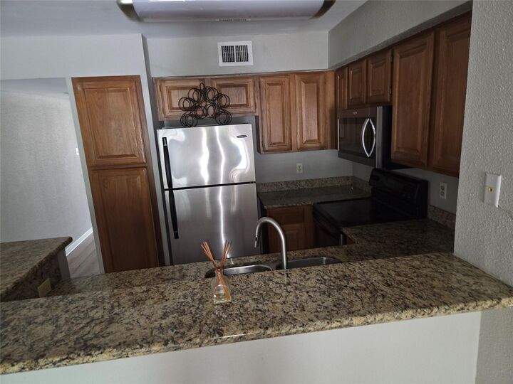Property Photo:  2425 Holly Hall Street 107  TX 77054 