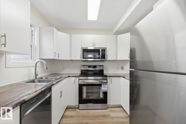 Property Photo:  10475 24 Avenue NW  AB T6J 4S2 