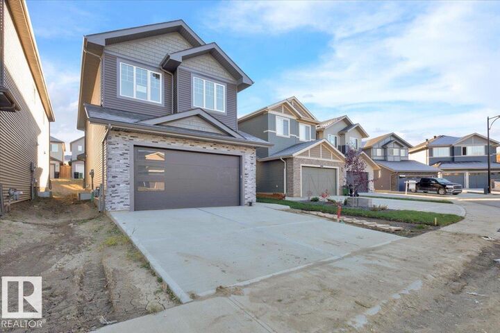 Property Photo: 1115 Gyrfalcon Crescent NW AB T5S 0S1