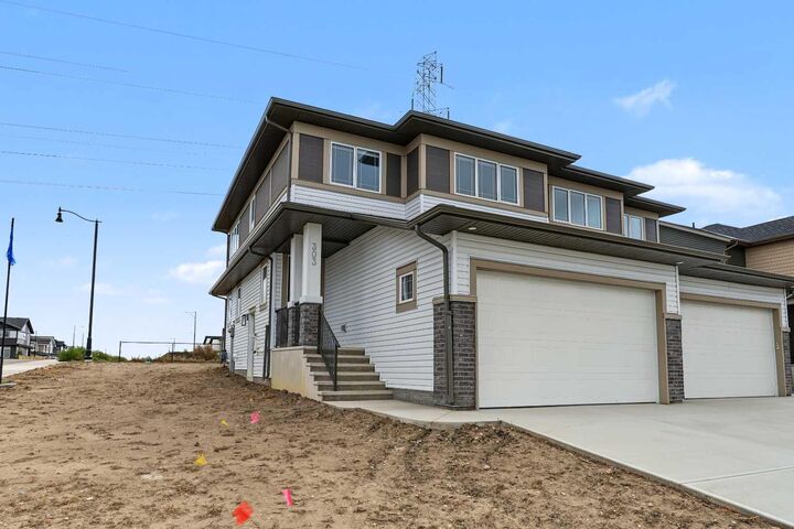 Property Photo:  303 Dawson Dock Way  AB T1X 2W4 