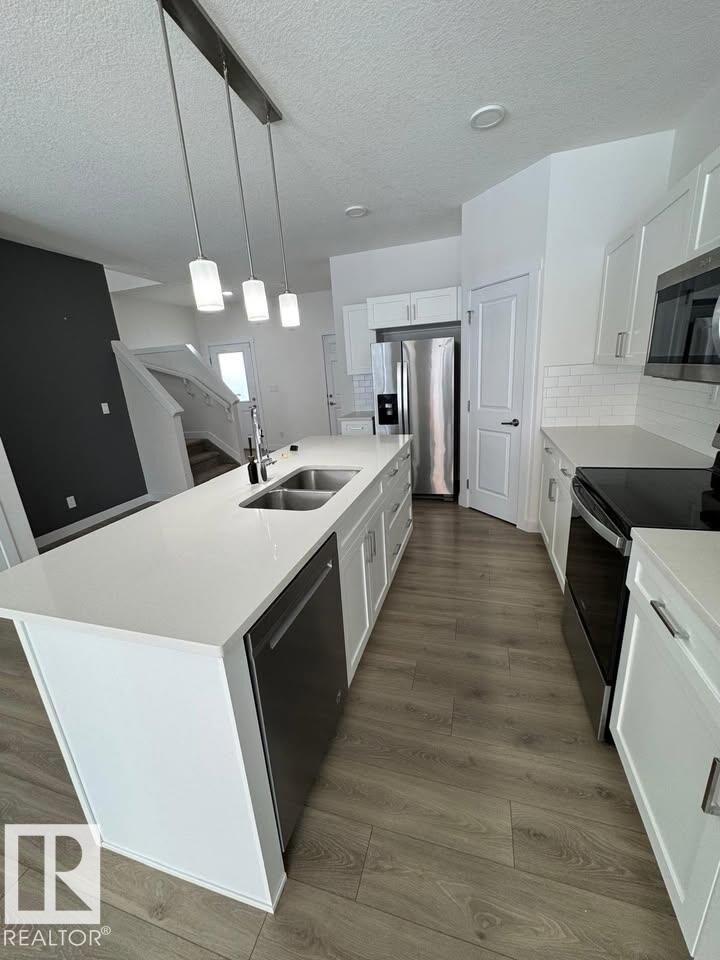 Property Photo:  938 Daniels Loop SW  AB T6W 4Y4 