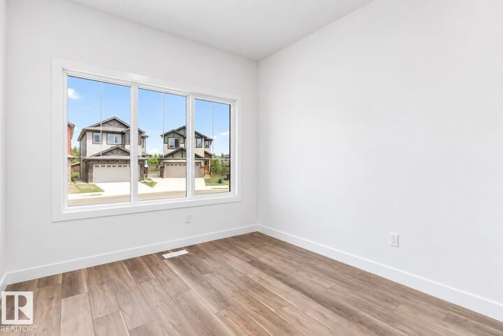 Property Photo: 4562 Warbler Loop NW AB T5S 0W8