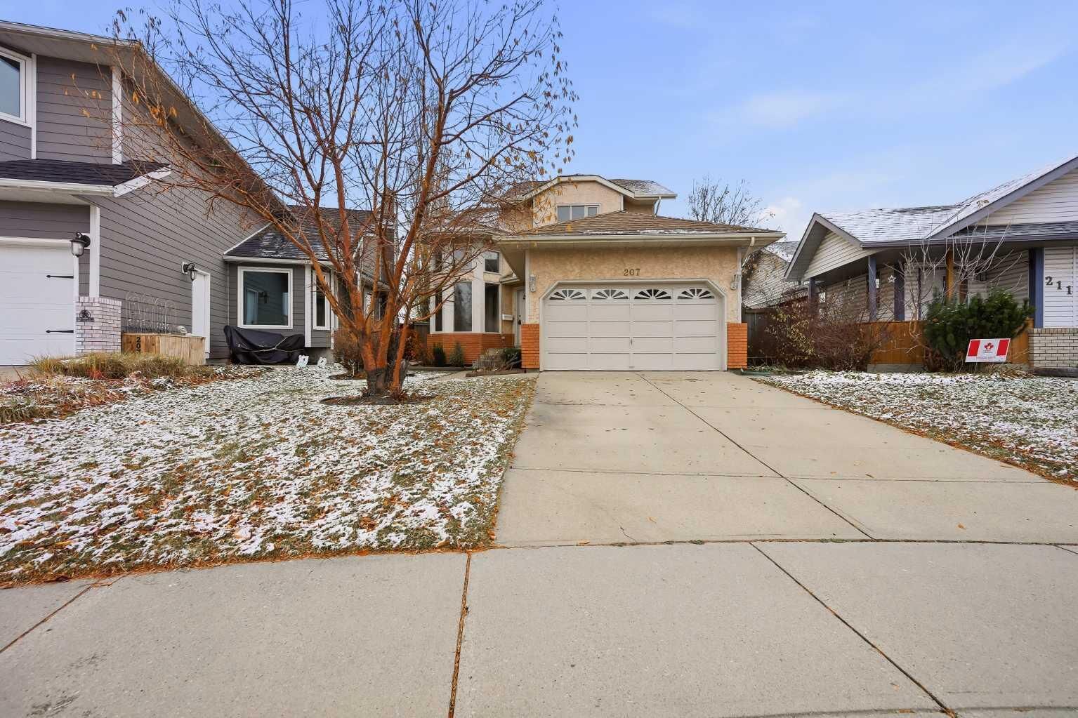 Property Photo:  207 Riverside Way SE  AB T2C 3V9 