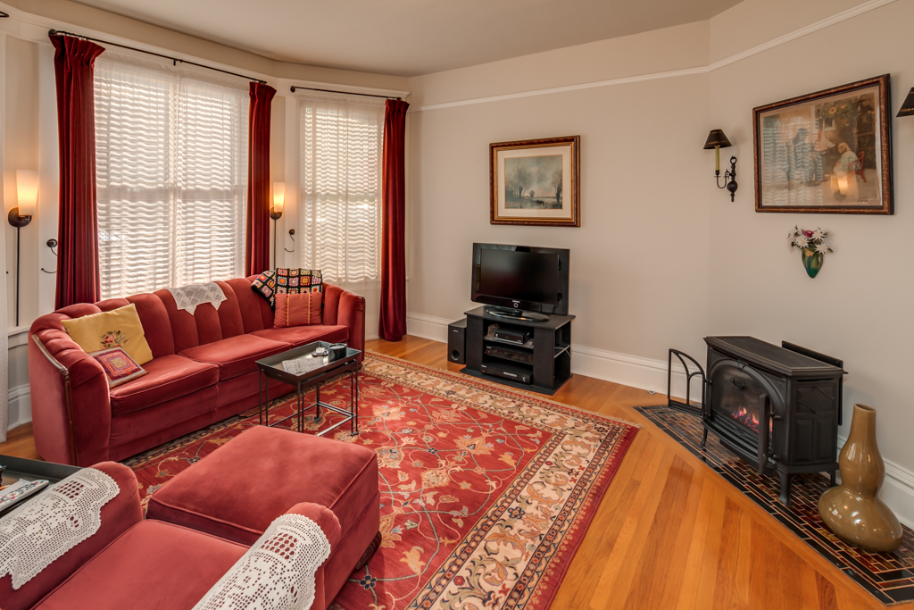 Property Photo: The living room is just off the entry and has two separate openings into it, a freestanding gas fireplace on a really great tile inset and large bay windows. 315 N Forest St  WA 98225 