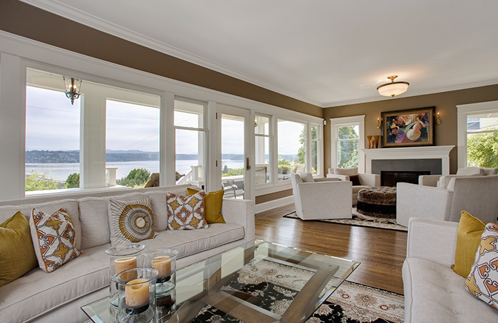 Property Photo: Spacious living room with fireplace, two sitting areas, access to the covered front porch with panoramic views to the lake and mountains 1333 Lake Washington Blvd S  WA 98144 