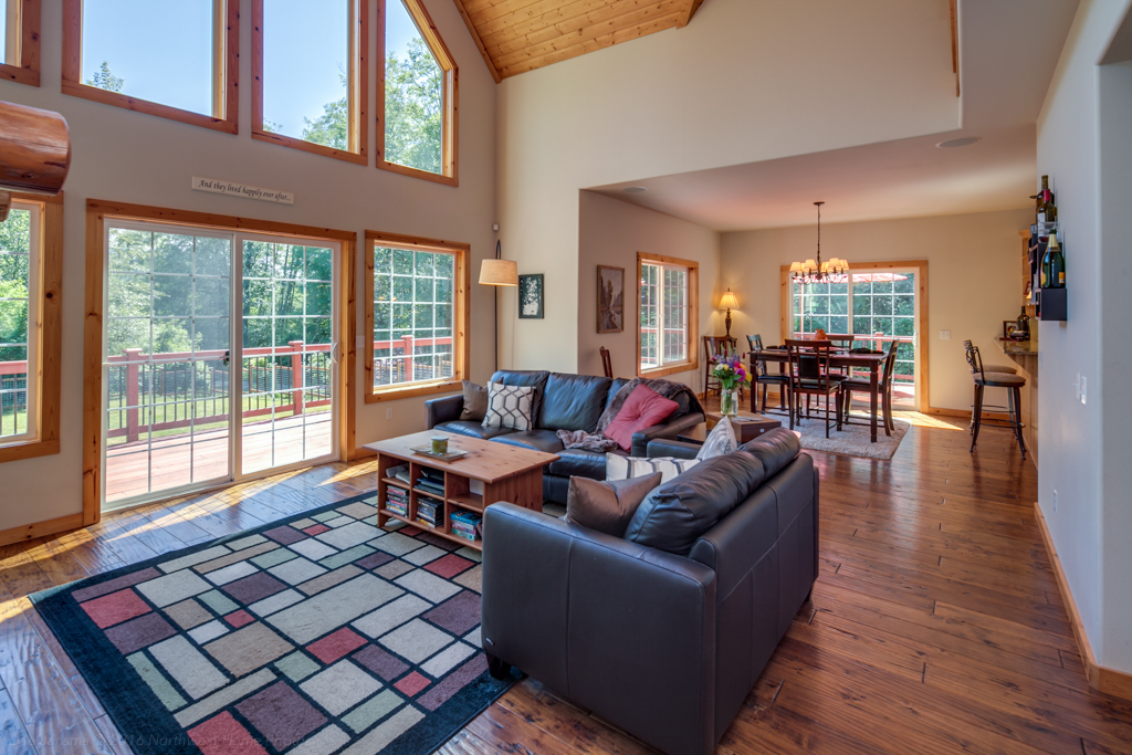 Property Photo: The great room has a huge slider, hardwood flooring and 2 story vaulted ceilings that are wood lined and amazing! 238 Appaloosa Lane  WA 98229 