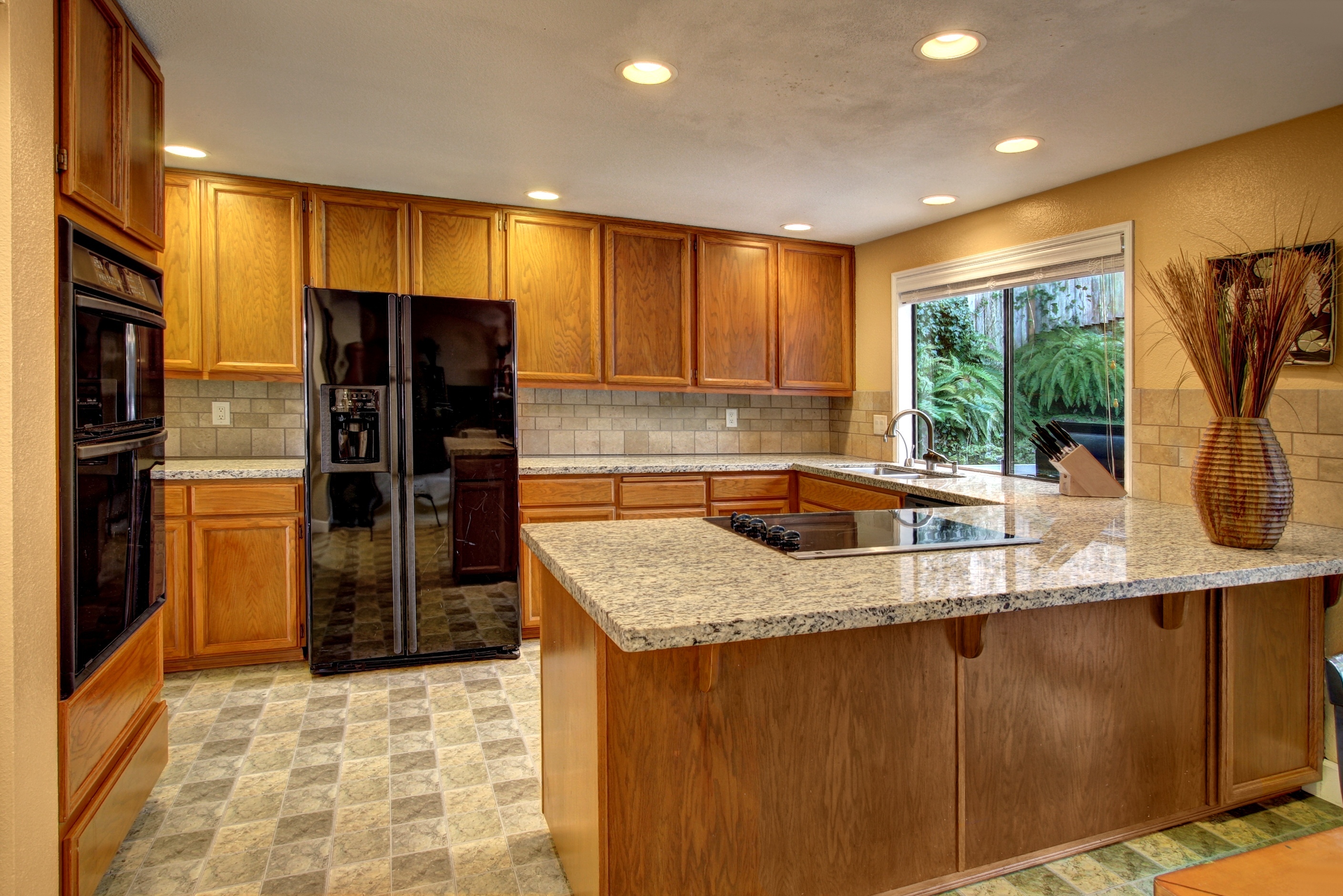 Property Photo: The oak & granite kitchen 15323 SE 49th Place  WA 98006 