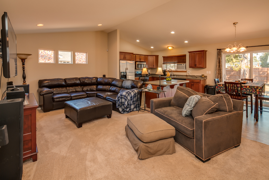 Property Photo: Looking from the entry across the living room with the dining and kitchen beyond. 6492 Trigg Woods Lane WA 98248